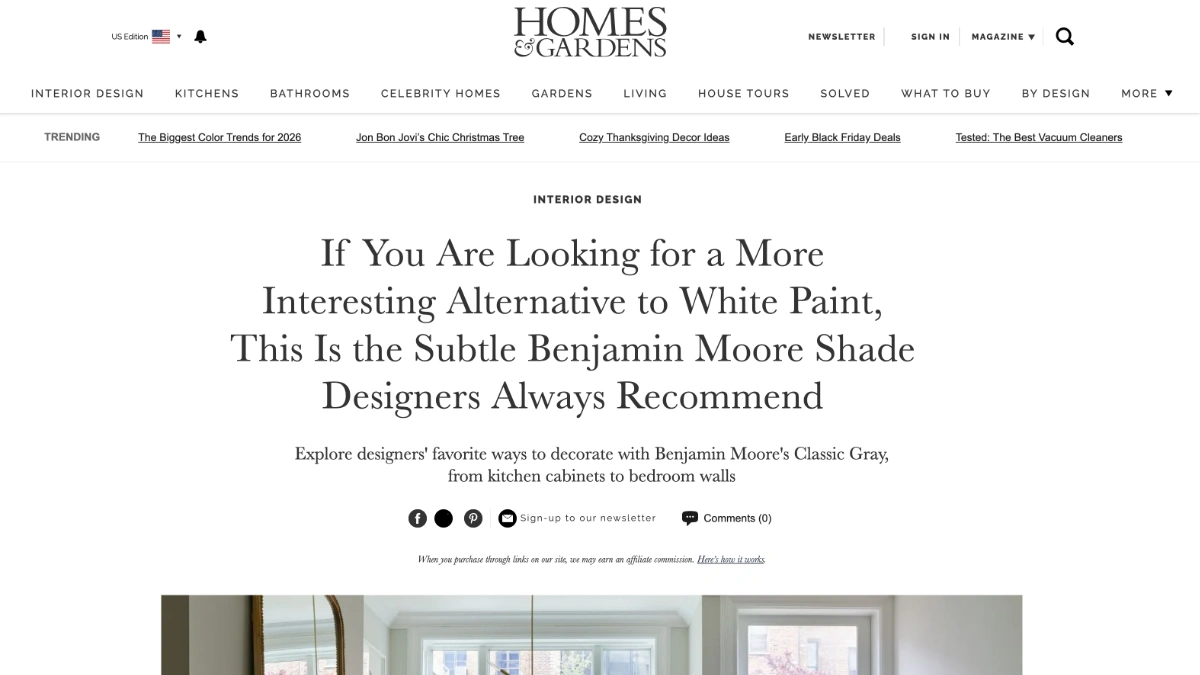 A press article screenshot from Homes & Gardens featuring the headline about Benjamin Moore's Classic Gray paint as an alternative to white.