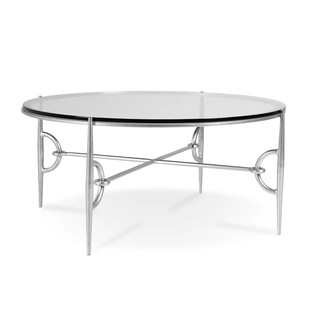 A round cocktail table featuring a clear glass top and a polished silver metal base with tapered legs and decorative ring accents.
